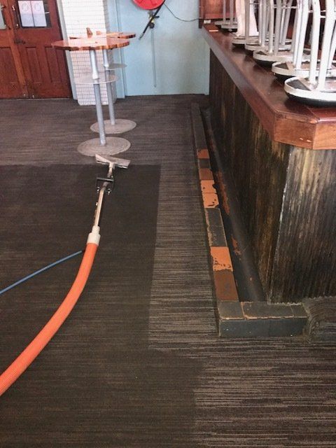 Carpet Cleaning Using A Vacuum — Carpet Cleaners in Albion Park Rail, NSW