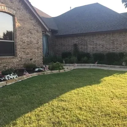 Stoned edge with fresh cut grass 