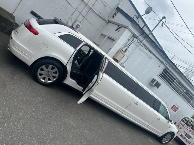 Lincoln MKT Limo Side panel glass replacement in Beaverton, OR