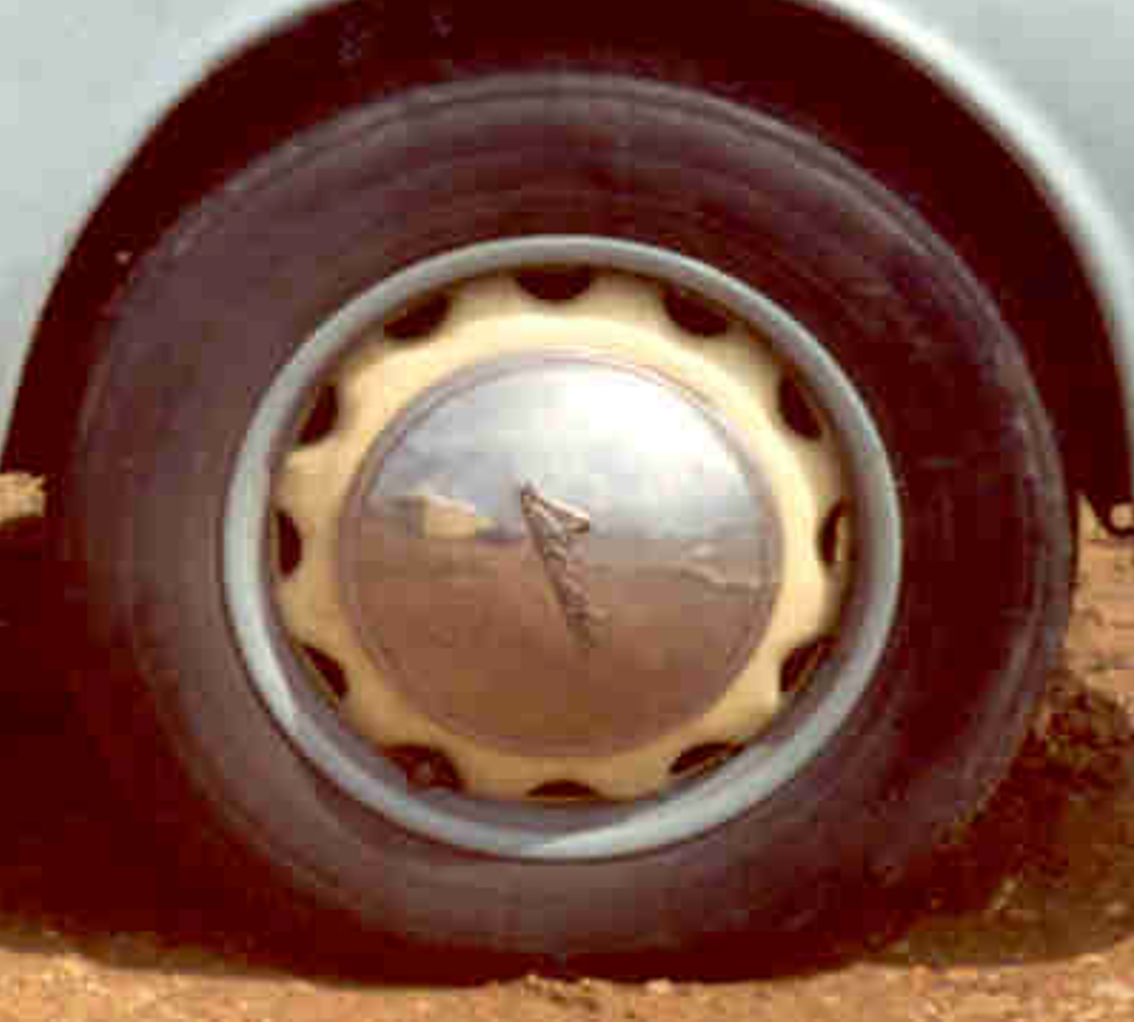 A black and white drawing of a wheel with a brake system.
