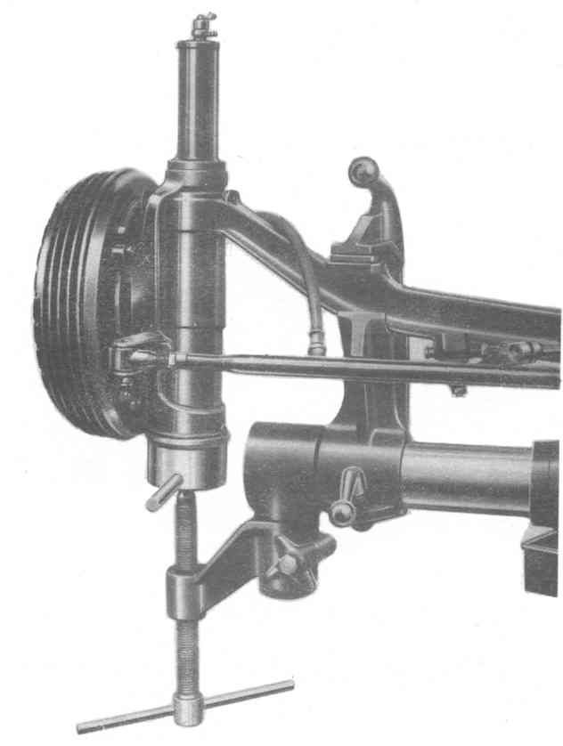 A black and white photo of a machine with a hose attached to it