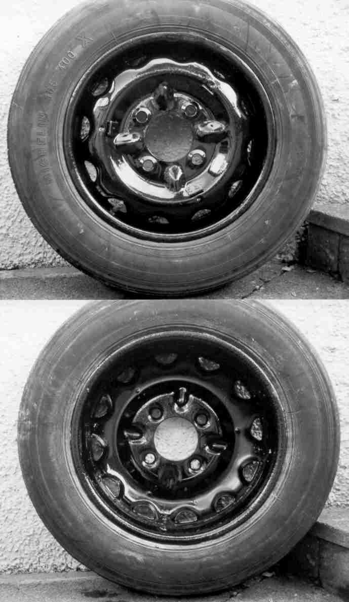 A black and white drawing of a wheel with a brake system.