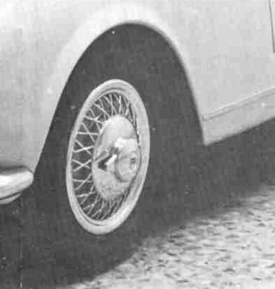 A black and white drawing of a wheel with a brake system.
