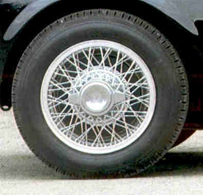 A black and white drawing of a wheel with a brake system.
