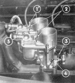 A black and white photo of a carburetor with numbers 1 through 4 on it