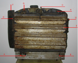 A very old piece of metal has a lot of letters on it