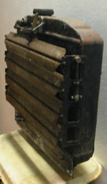 A wooden box with a handle sits on a table