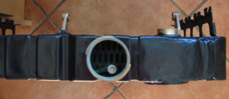 A black object with a white circle in the middle