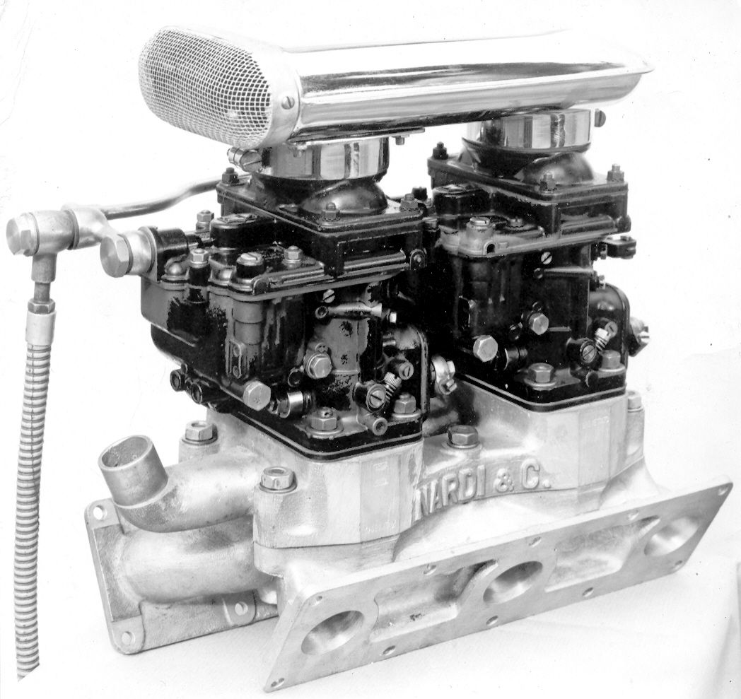 A black and white photo of a carburetor that says hfd & c.