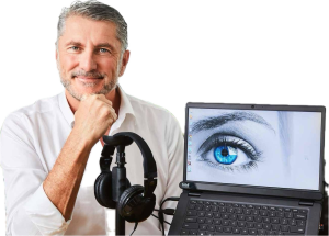 A Man With Headphones And A Laptop With A Blue Eye On The Screen  — Surveillance NQ In Aitkenvale, QLD