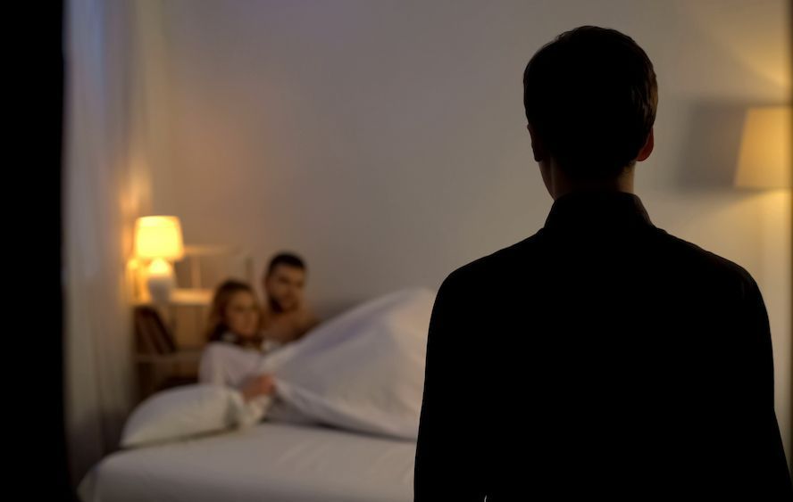 A Man Is Standing In Front Of A Bed With A Woman And A Man — Surveillance NQ In Aitkenvale, QLD