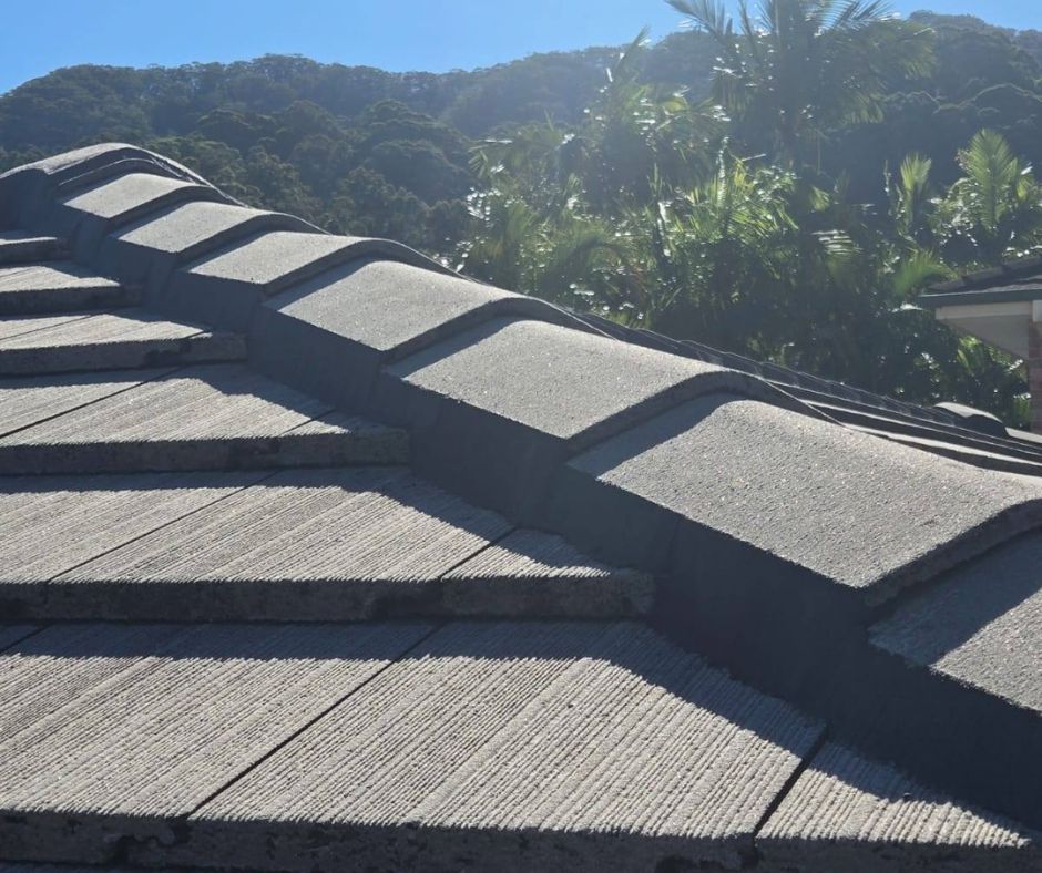 Freshly finished ridge capping showing repointing roof tiles on a tiled roof.