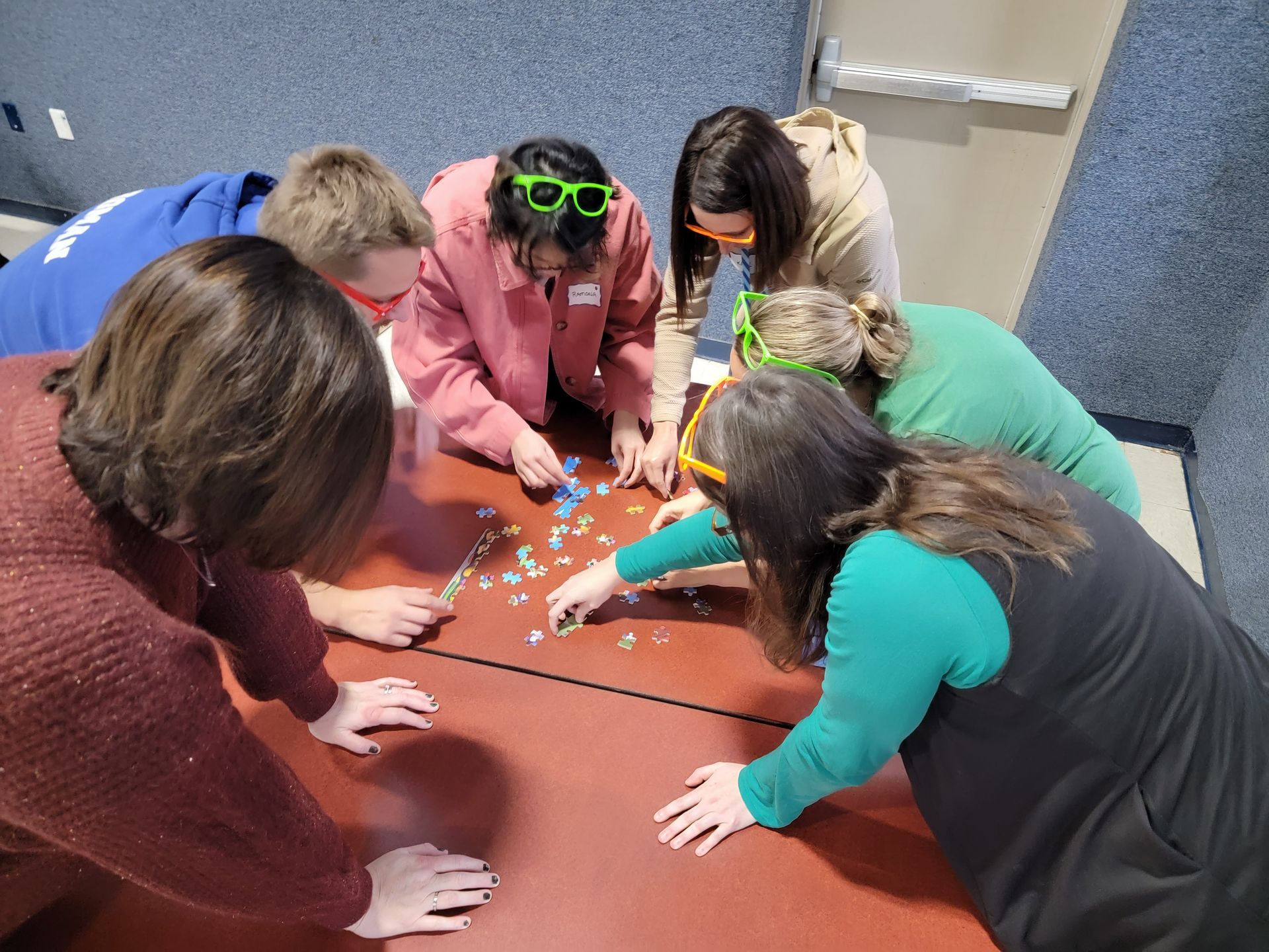 A group of people are playing a game on a table.