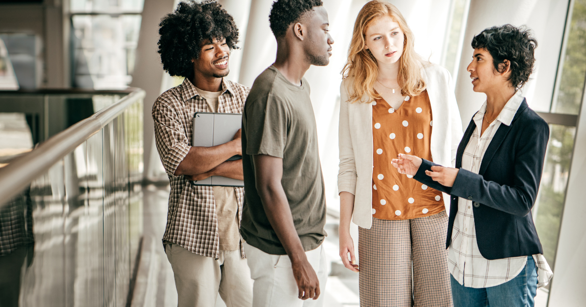 4 people standing chatting about job opportunities