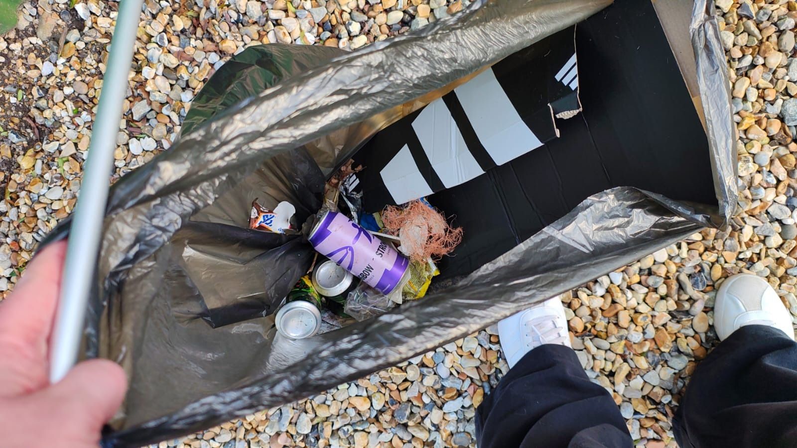 a black bin bag with rubbish in from a litter pick 