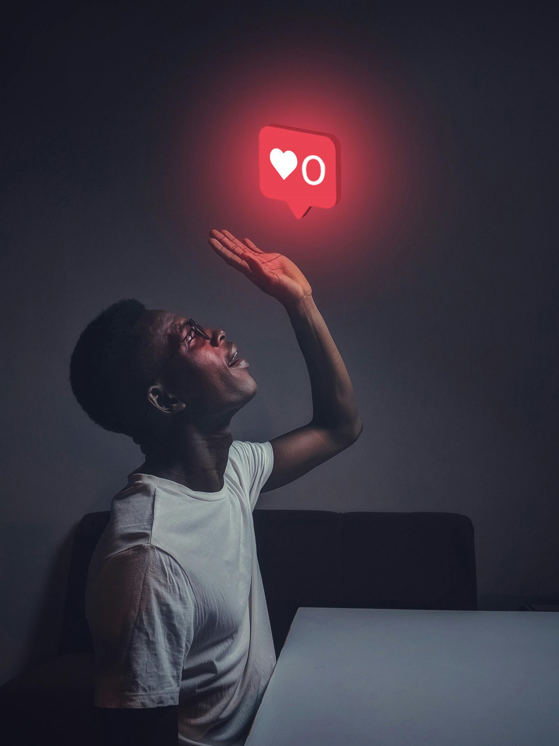 man with illuminated social icon