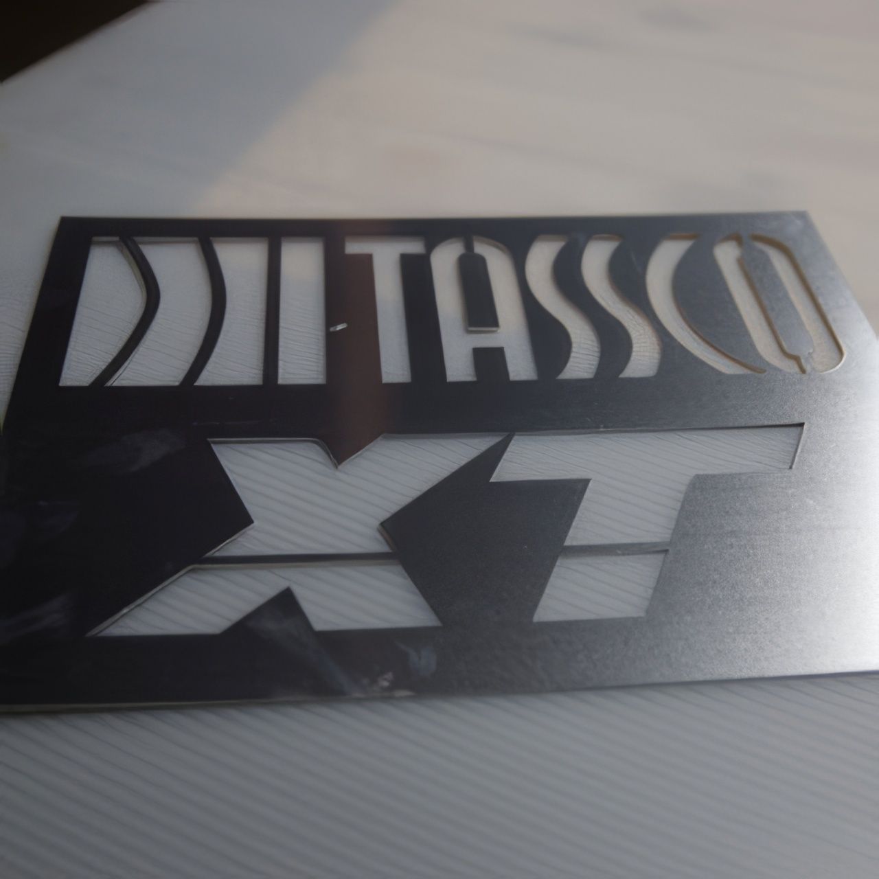 A sign that has the word tassco on it