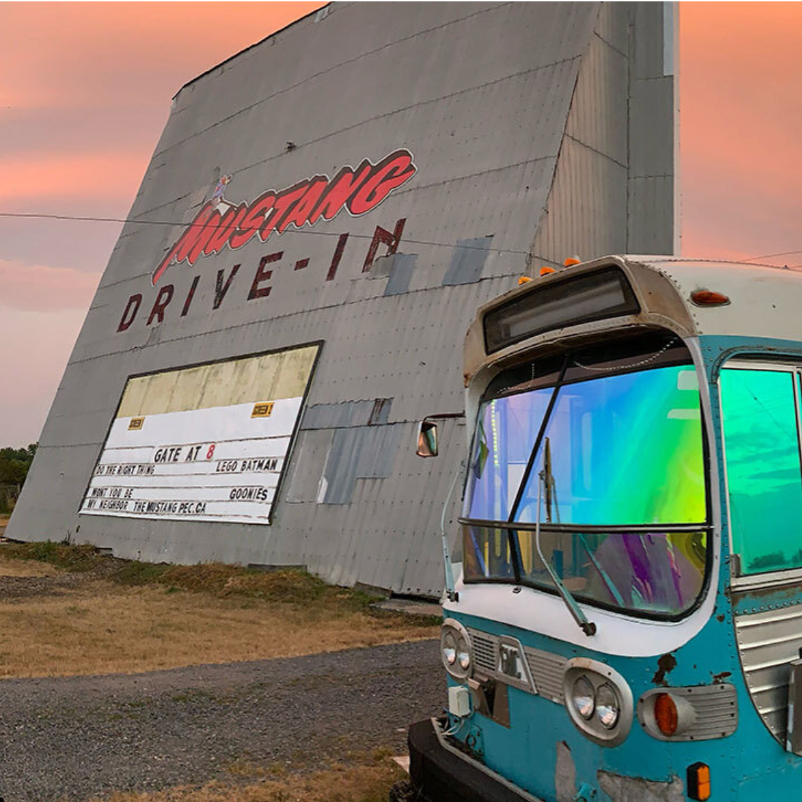 Picture of the large outdoor theatre screen at the Mustang Drive-In PEC