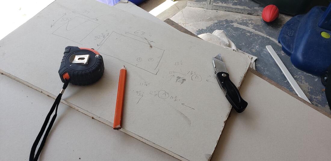 Photo of drywall installation tools on a job site