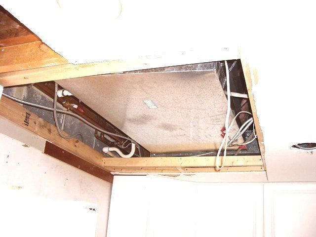 Picture of a section of ceiling needing a drywall patch.
