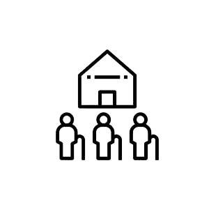 A group of people standing in front of a house.