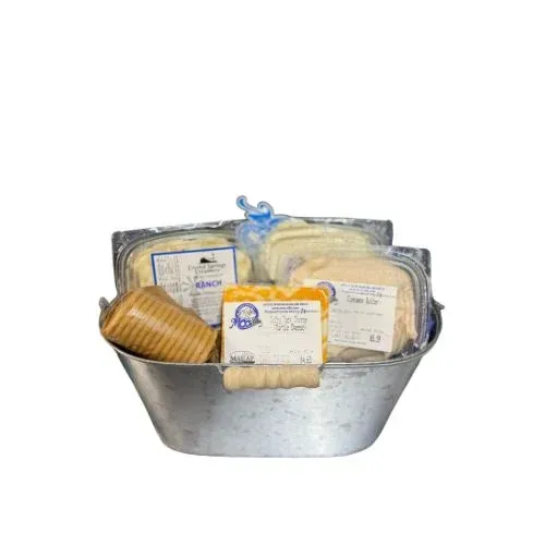 A metal basket filled with cheese and crackers.