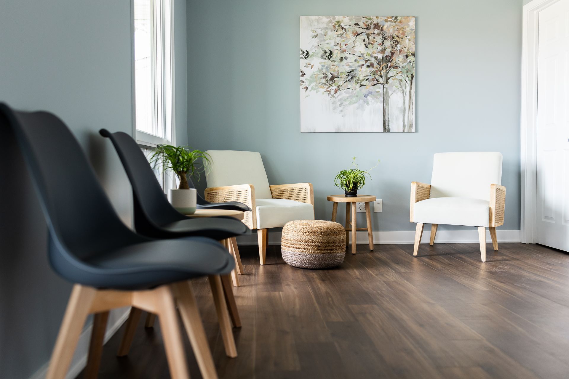 A peaceful lobby with soothing colors, modern decor, and many chairs