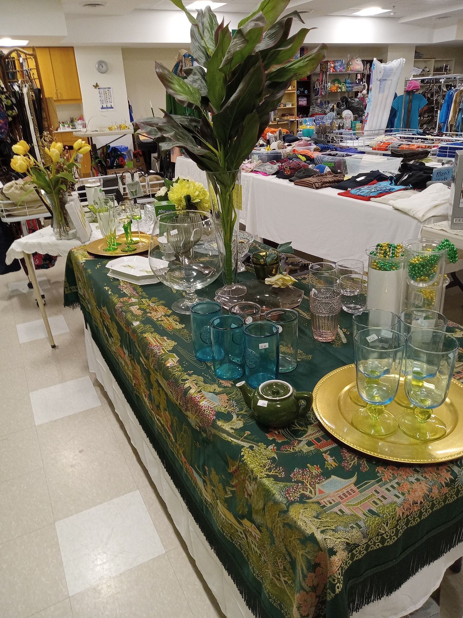 A tabletop of various decorative kitchenware such as glasses and plates.
