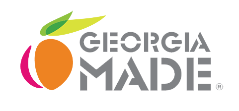 The logo for georgia made is a peach with a green leaf on it.