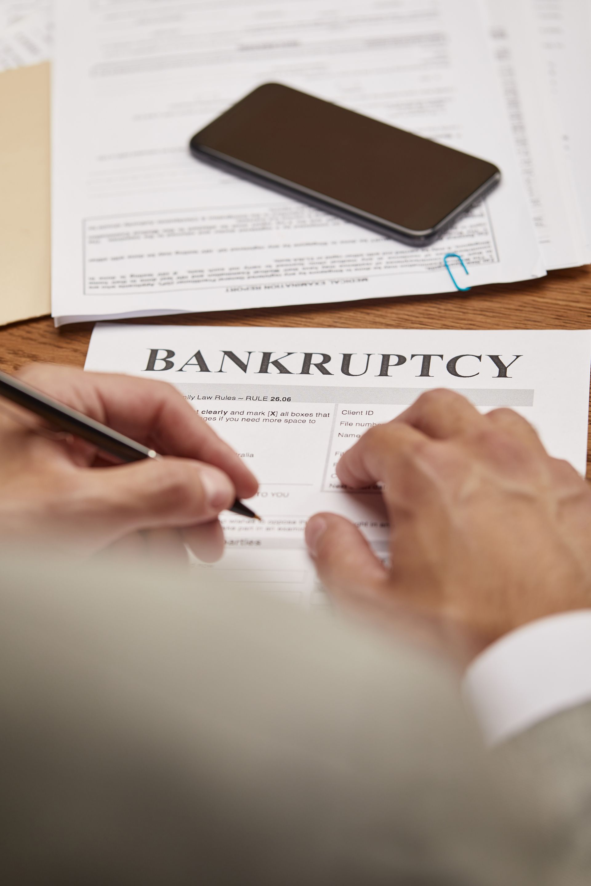 Person filling out bankruptcy form, representing Chapter 7 bankruptcy in South Carolina.
