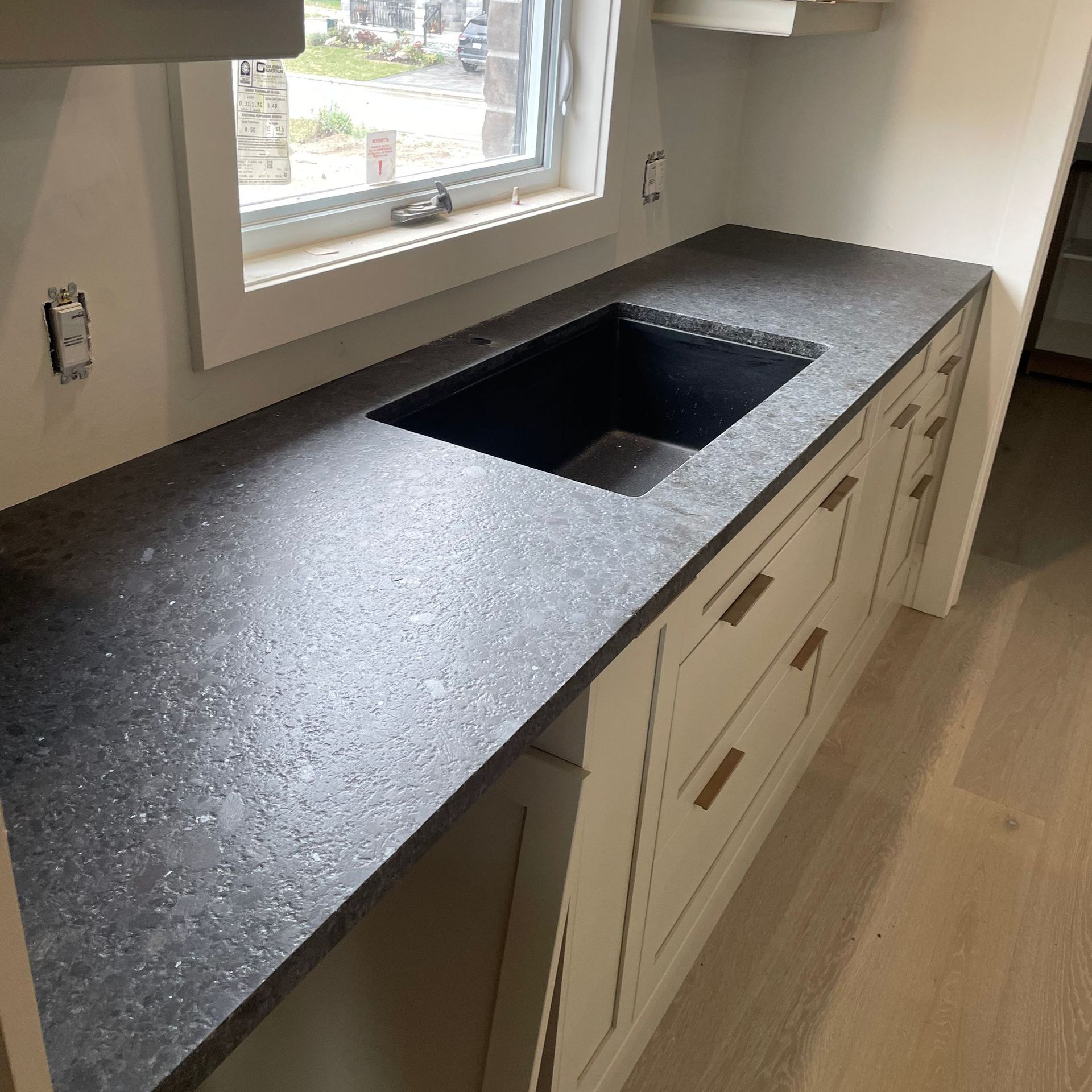 A kitchen with stainless steel appliances and wooden cabinets