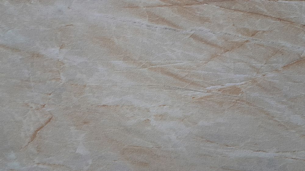 Beige and tan marbled surface with veining.