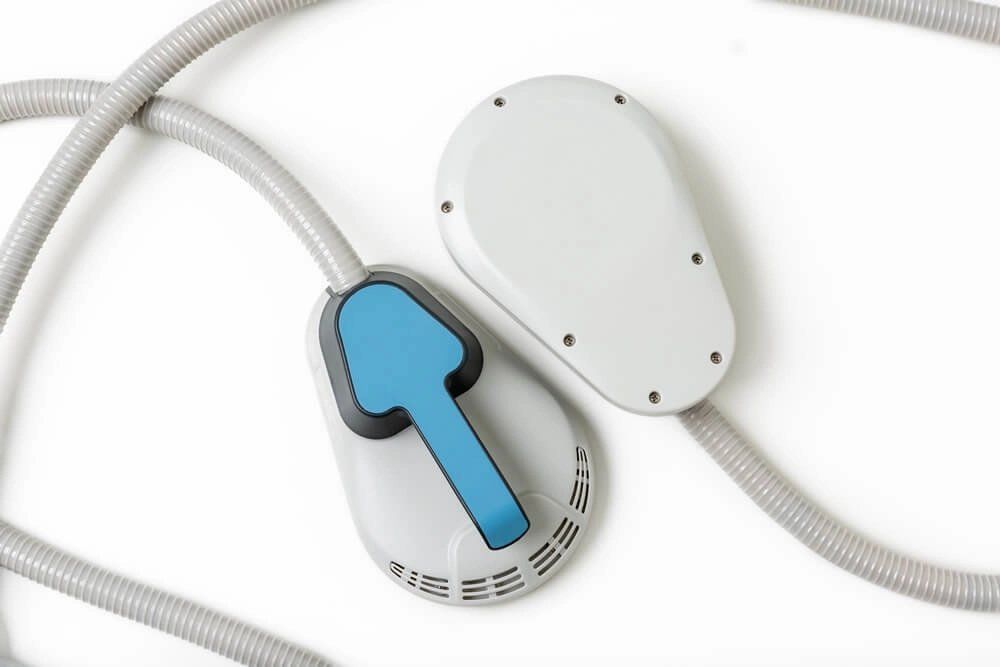 a blue and white device with a hose attached to it