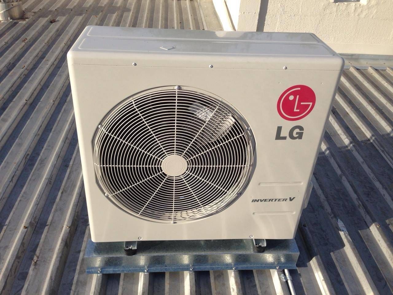 Lg Air Conditioning Unit on A Corrugated Metal Roof — Allchin Airconditioning & Refrigeration Electrical in Caloundra, QLD