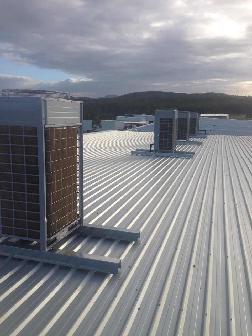 Air Conditioning Units on A Corrugated Metal Roof — Allchin Airconditioning & Refrigeration Electrical in Caloundra, QLD