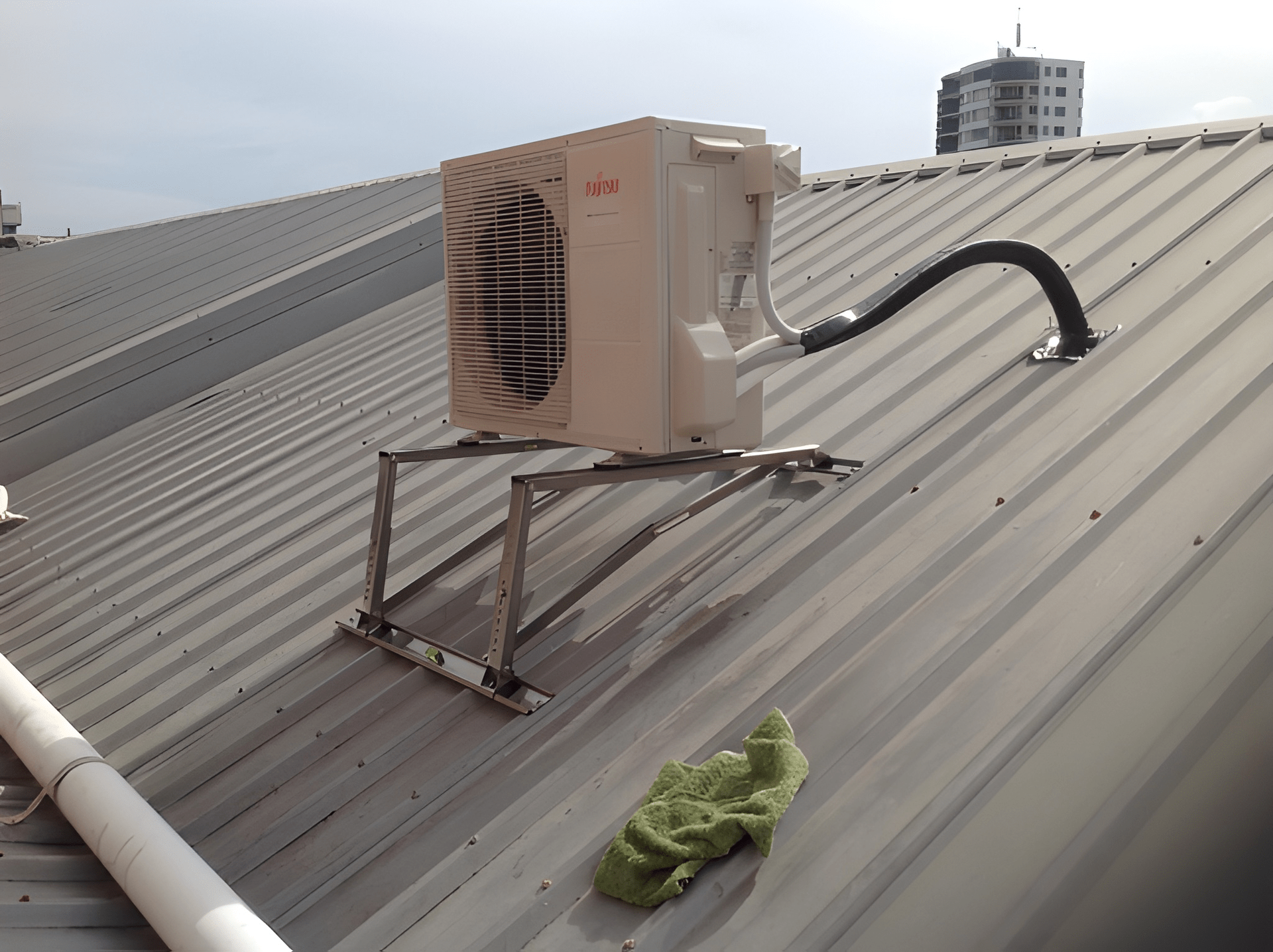 Air Conditioner Unit on A Metal Roof — Allchin Airconditioning & Refrigeration Electrical in Caloundra, QLD