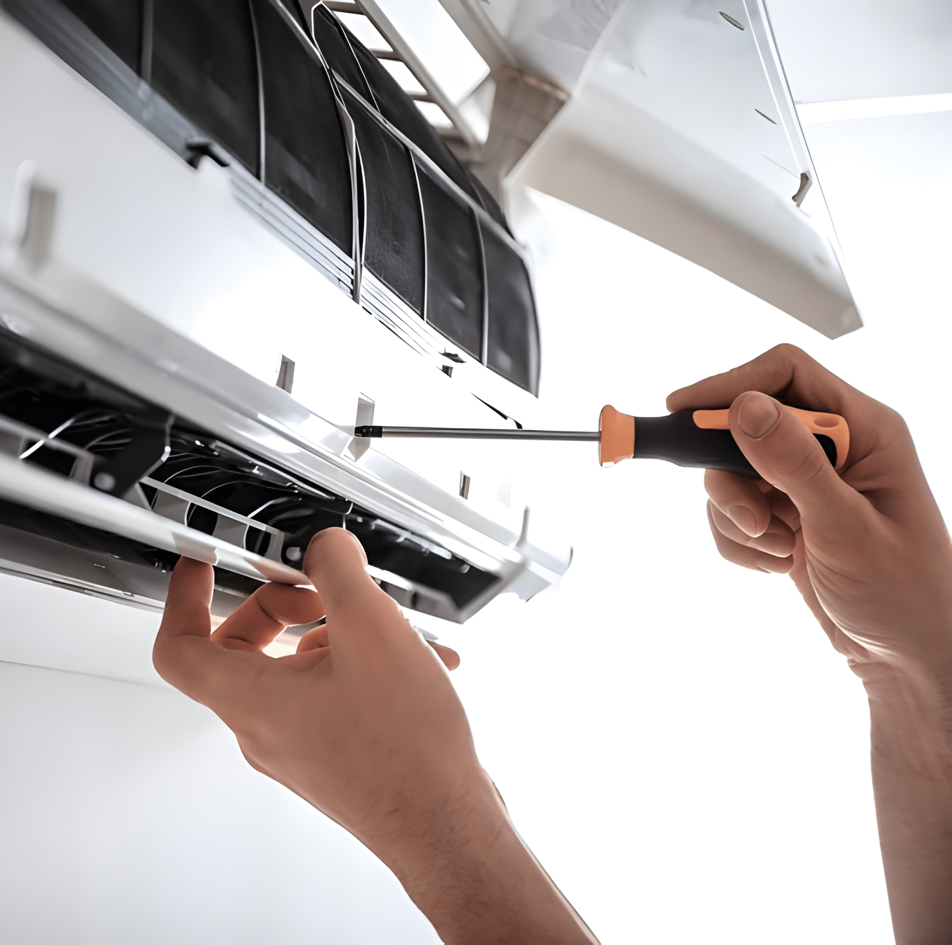 A Person Using a Screwdriver to Repair an Air Conditioning Unit — Allchin Airconditioning & Refrigeration Electrical in Noosa, QLD