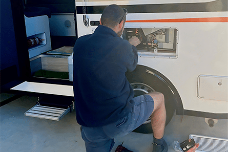 A Man Is Working — Allchin Airconditioning & Refrigeration Electrical in Caloundra, QLD