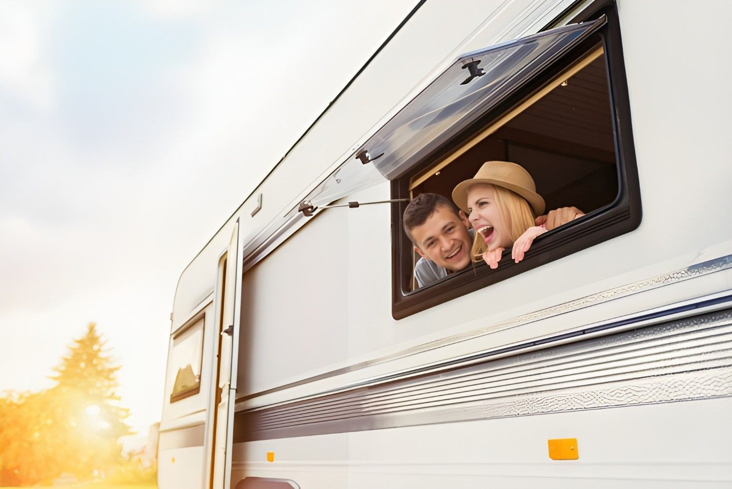 A Couple Peeking out Of Rv Window — Allchin Airconditioning & Refrigeration Electrical In Kawana, QLD