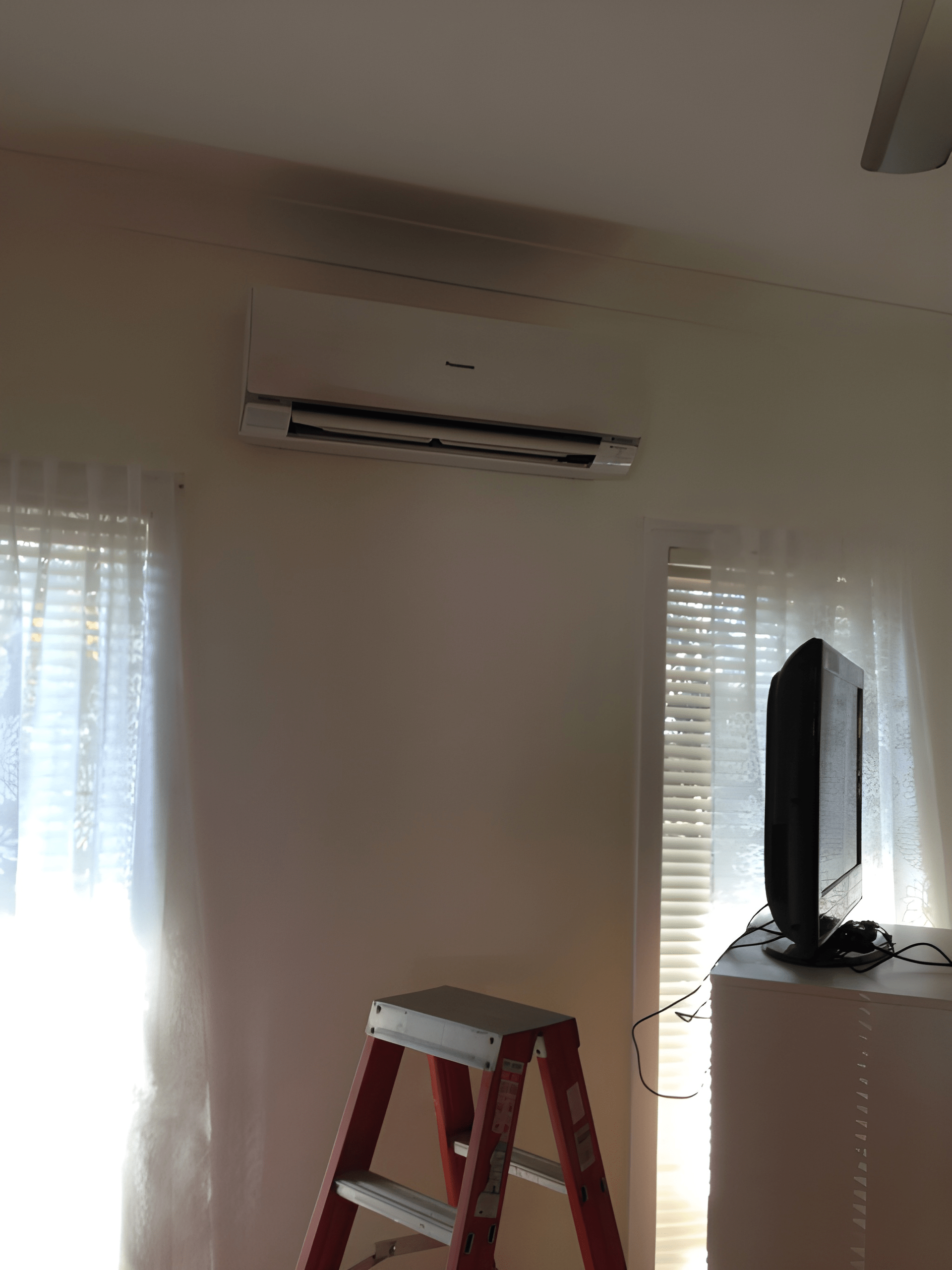 Air Conditioner on A White Wall — Allchin Airconditioning & Refrigeration Electrical In Palmview, QLD