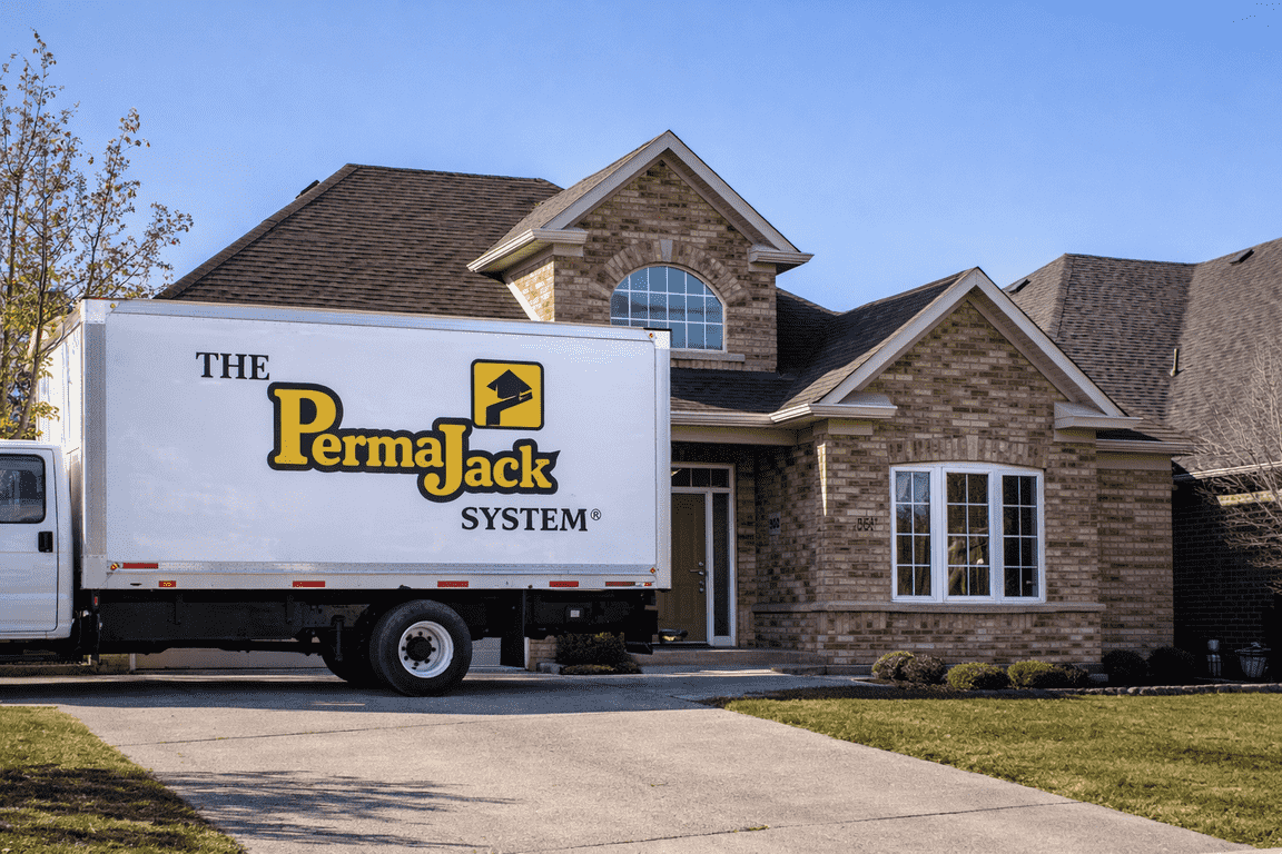PermaJack Tulsa truck at residential home for foundation repair inspection.