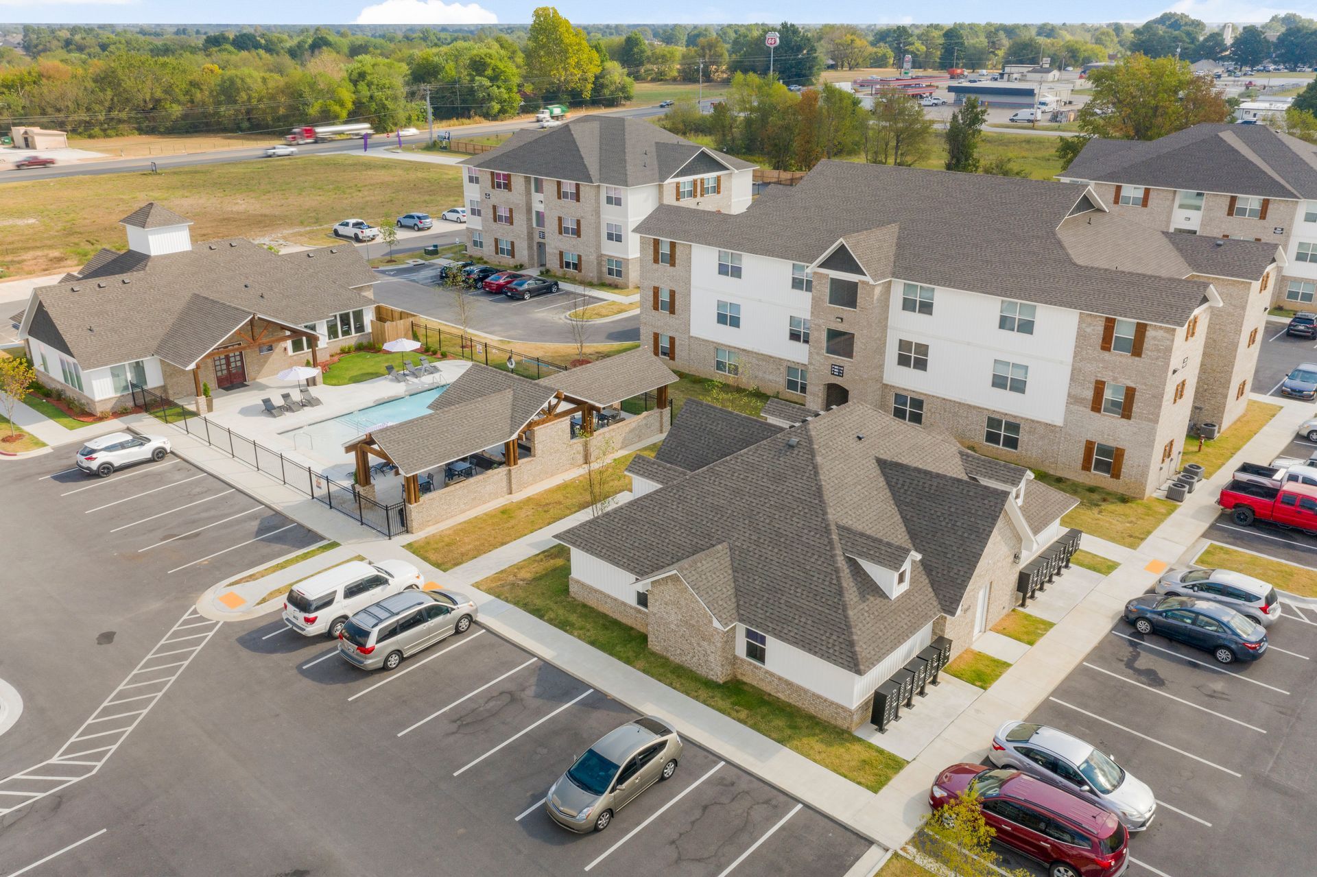 birds eye view of property and parking lot