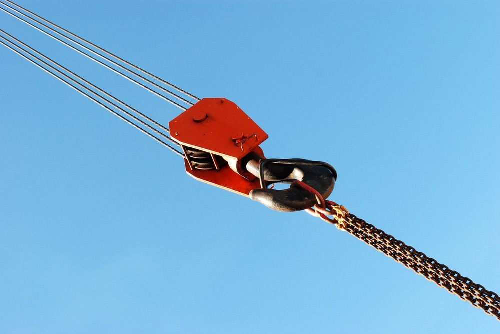 A Close Up Of A Crane Hook Against A Blue Sky — S & W Crane Hire In Collinsville, QLD