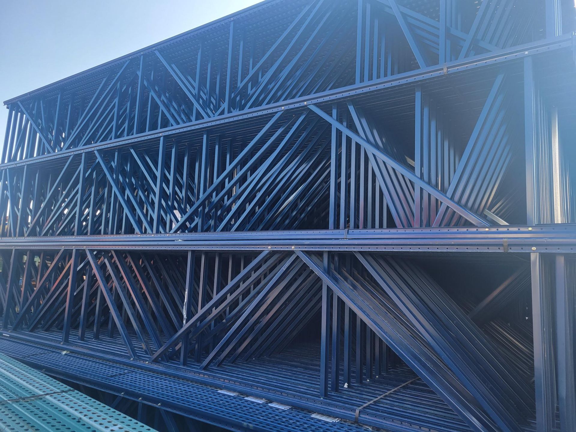 A stack of metal beams are stacked on top of each other.