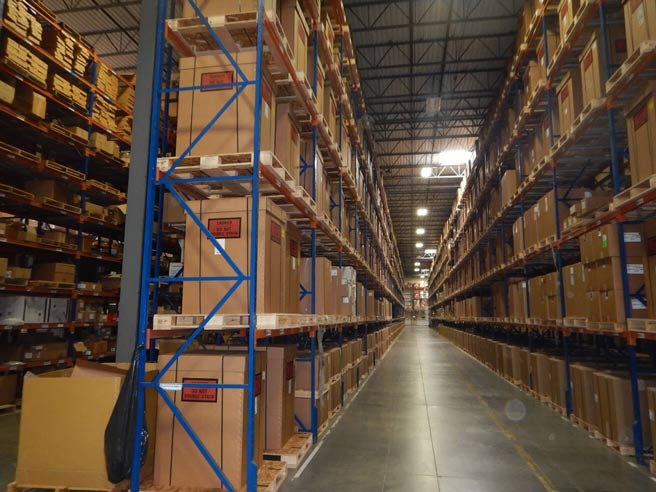 Warehouse Equipment Solutions — Boxes in the Pallet Racks Inside the Warehouse in Grand Prairie, TX