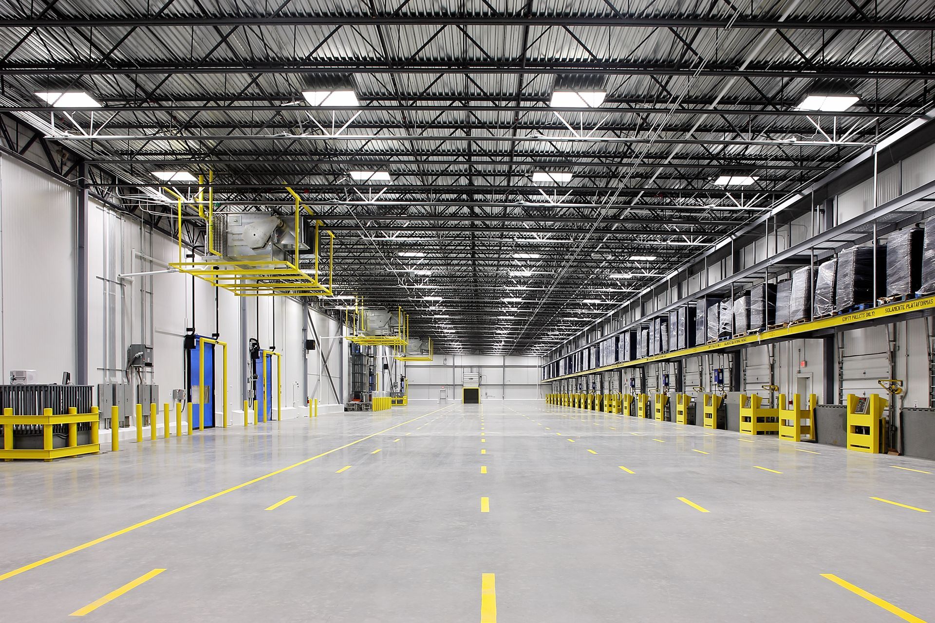 Interior of an empty warehouse or industrial storage building.