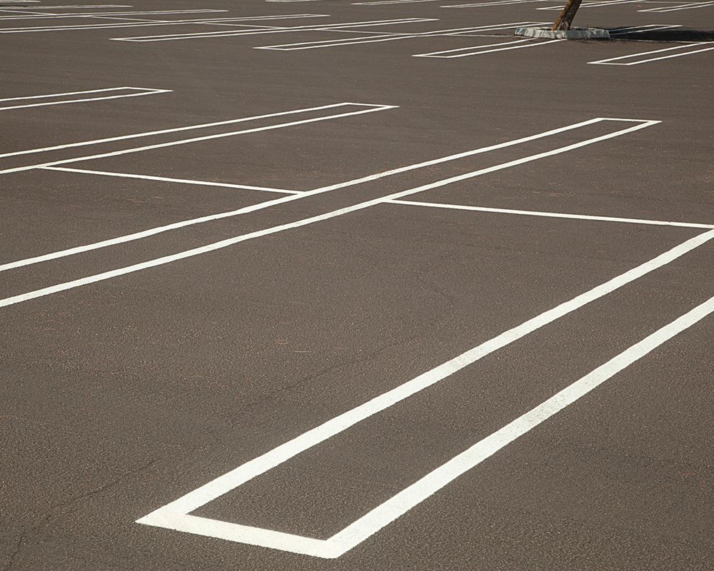 Newly painted striping in a parking lot with no cars | Warehouse Equipment Solutions | Desoto, TX