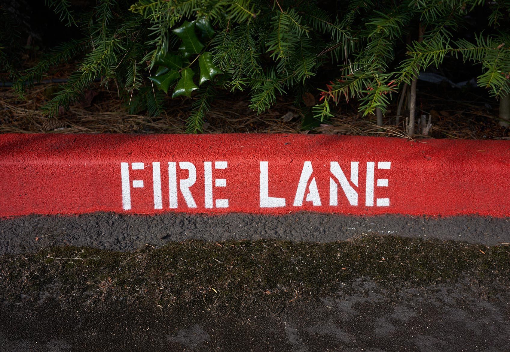 Painted fire lane curb markings. Painted fire lane curb markings.