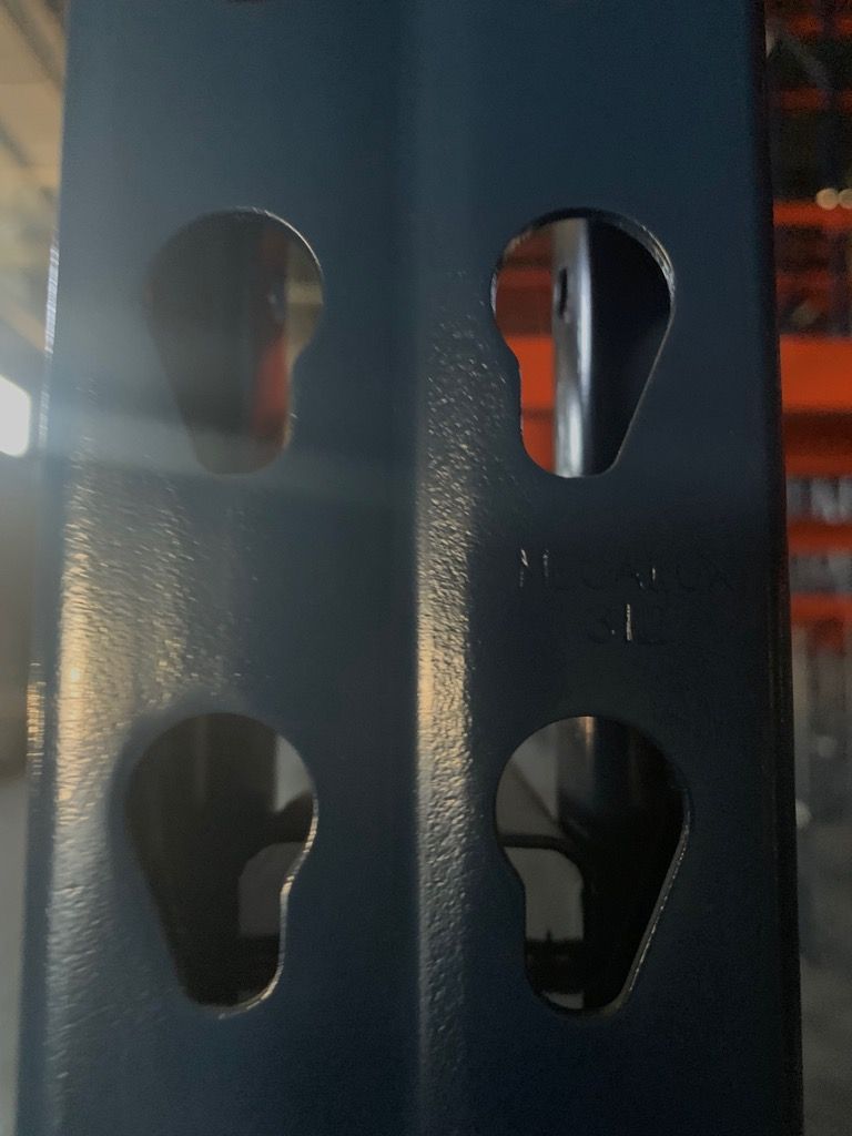 A close up of a metal structure with holes in it