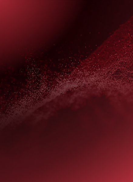 A close up of a red background with a swirl of dust coming out of it.